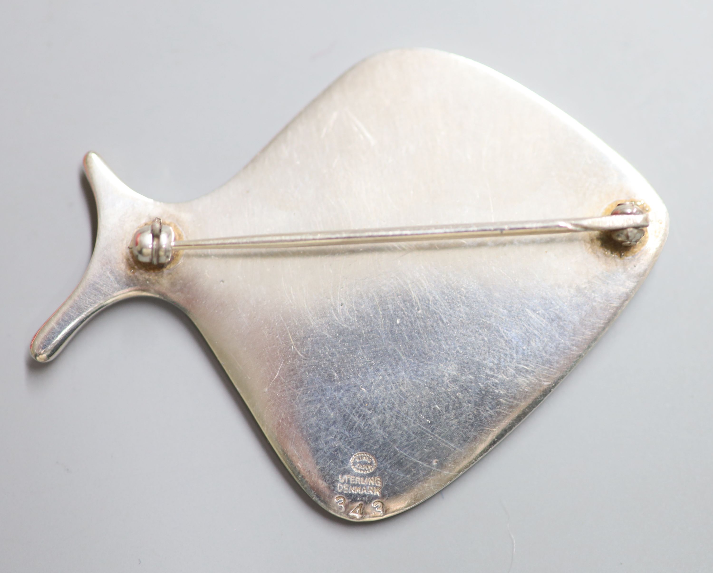 A Georg Jensen 925 and pale blue enamel stylised fish brooch, design no. 343, 57mm, gross 20.3 grams.